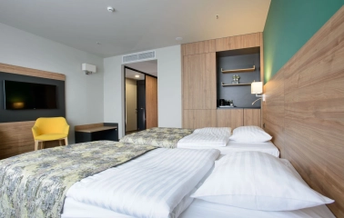 Room with two twin beds at the Favor Park Hotel in Kyiv