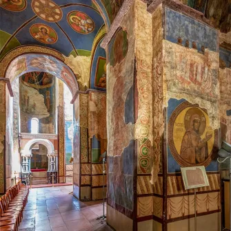 St. Cyril's Church in Kyiv- arched corridor with ceiling medallions and wall murals
