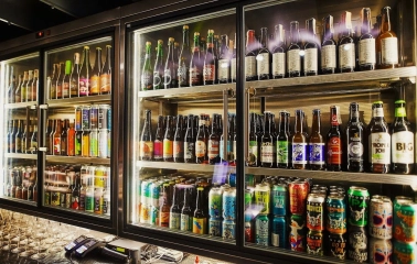 Punkraft - close-up of a wide selection of bottled craft beers on display shelves