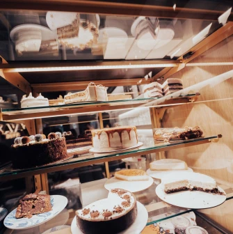 Takava in Kyiv - glass display case filled with various cakes and desserts