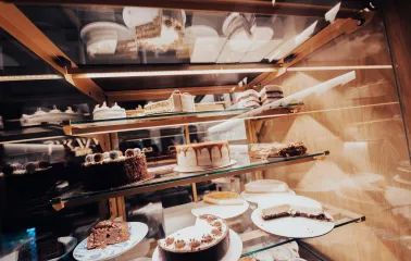 Takava in Kyiv - glass display case filled with various cakes and desserts