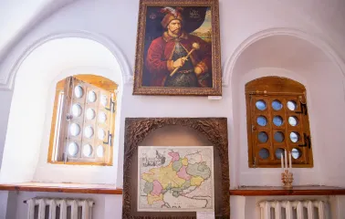 Muzei Hetmanstva in Kyiv - thick white walls with arched window niches displaying a historic portrait of a Hetman and an ancient map of Ukraine