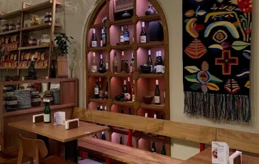 Poltava – cozy interior with arched wine shelf and traditional embroidered decor