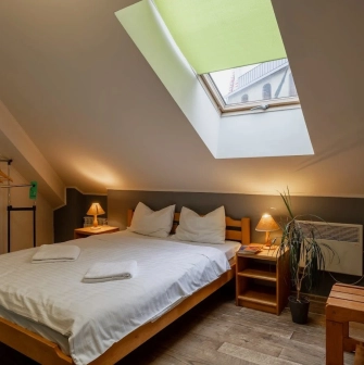 Room on the attic floor with a double bed at Dream Hostel in Kyiv