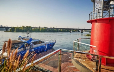 Mayak - close-up view of a boat docked at the restaurant's pier on the water