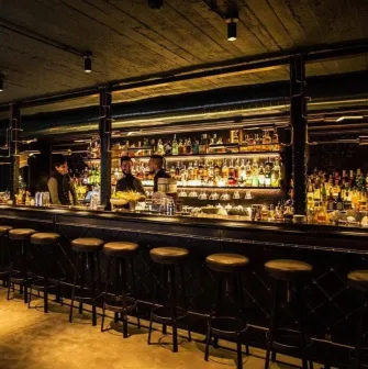 Bar counter with drinks at Hendrick's Bar in Kyiv