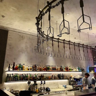 Holy Burger - bar counter displaying drinks and a draft beer selection