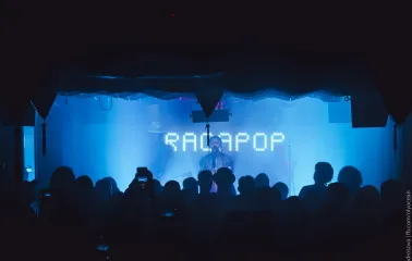 A music band performing on stage at the "Hvlv" bar in Podil, Kyiv