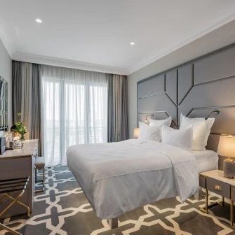 Cozy bedroom with elegant interior at the premium Edem hotel in Kyiv