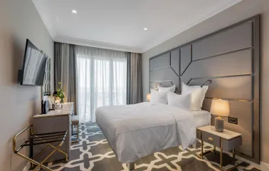 Cozy bedroom with elegant interior at the premium Edem hotel in Kyiv
