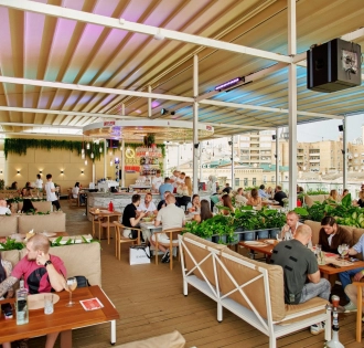 Q Terrace - a spacious open terrace with sofas and lots of greenery