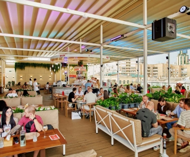 Q Terrace - a spacious open terrace with sofas and lots of greenery