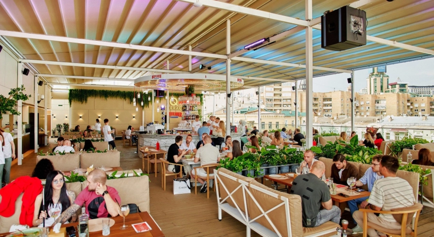 Q Terrace - a spacious open terrace with sofas and lots of greenery