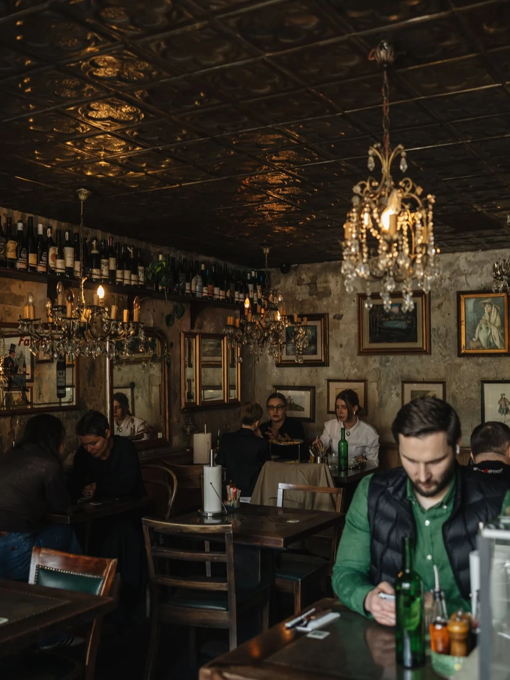 Cozy interior of Mimosa Brooklyn Pizza with chandeliers