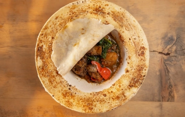Seliam in Kyiv - bowl with meat stew covered by thin baked flatbread