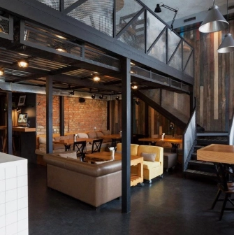 True Burger Bar - industrial style interior with exposed brick and varied comfortable seating