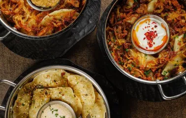Restaurant Chary - three bowls of vareniky and dumplings topped with fried onion and sour cream