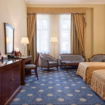 Classic room at Premier Palace Hotel in Kyiv with two beds and a seating area