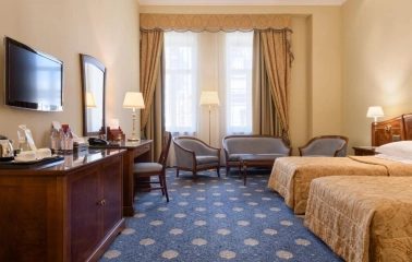 Classic room at Premier Palace Hotel in Kyiv with two beds and a seating area