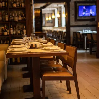 Cozy tables set for dinner at the "Whisky Corner" bar in Kyiv