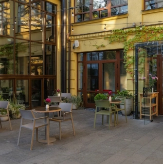 The courtyard of the Bursa Hotel in Kyiv with an outdoor terrace