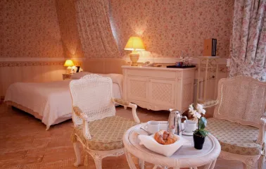 Opera Hotel - elegantly set restaurant table with fine china and silverware