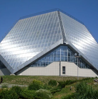 Modern greenhouse building with geometric shapes in the Kyiv Botanical Garden