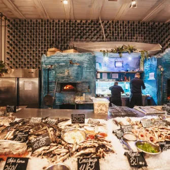 Seafood counter at Chornomorka restaurant in Kyiv with a large selection of fresh seafood