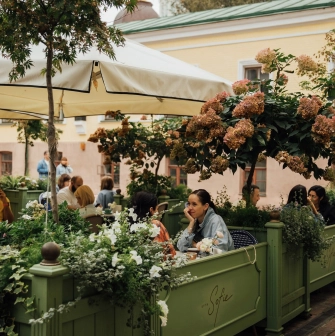 Etre Sofie - street terrace with comfortable seating and a view of the facade