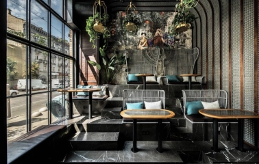NAM - dining area featuring elegant dark furniture and unique light fixtures