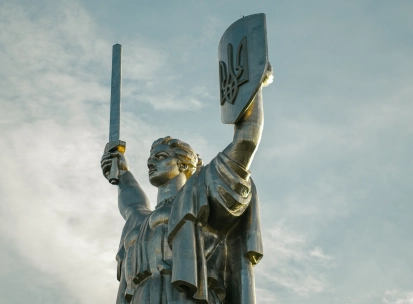 Motherland Monument in Kyiv - close-up of the statue's face and Trident shield