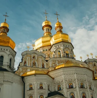 Kyiv Pechersk Lavra - Dormition Cathedral with golden domes and ornate white facade