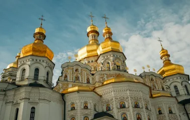 Kyiv Pechersk Lavra - Dormition Cathedral with golden domes and ornate white facade