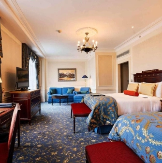 Spacious room with two beds at the Fairmont Grand Hotel in Kyiv