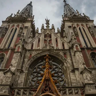 Bottom view of the facade of St. Nicholas Church with details of Gothic architecture