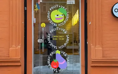 Fruit & Veg - light green painted cafe facade with large windows and simple sign