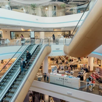 Interior view of TSUM shopping levels with escalators in Kyiv