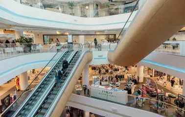 Interior view of TSUM shopping levels with escalators in Kyiv