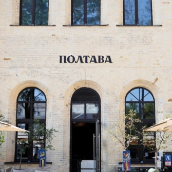 Poltava – restaurant exterior with brick facade and black arched windows