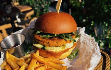Restaurant Trishky Bilshe - close-up of a veggie burger and french fries on an outdoor table