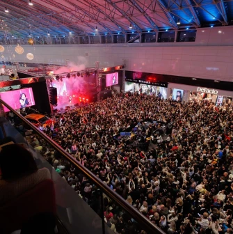 Large crowd watching a concert inside Lavina Mall near the main stage