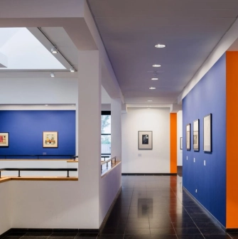 Art gallery with works on blue walls at Mystetskyi Arsenal