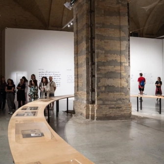 Exhibition hall of Mystetskyi Arsenal with arches and visitors
