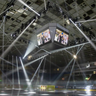 Palats Sportu in Kyiv - dramatic white spotlights beaming through the darkness onto the ice rink