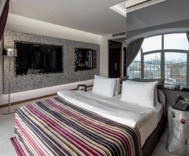 Designer room at the 11 Mirrors Design Hotel in Kyiv with modern decor and mirrored partitions