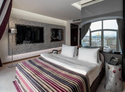 Designer room at the 11 Mirrors Design Hotel in Kyiv with modern decor and mirrored partitions