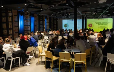 UNIT.City - bustling conference hall filled with attendees at a large event