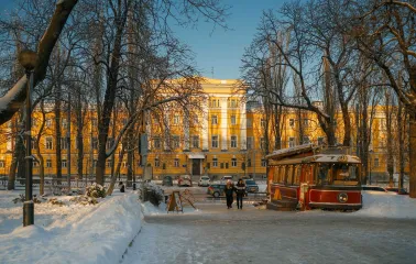 Yellow facade of Institute of Philology KNU near the park in Kyiv