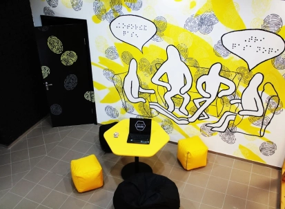 Muzei u Temriavi in Kyiv - creative lounge space with a yellow hexagonal table