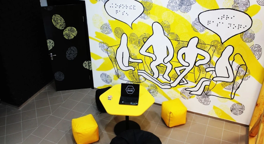 Muzei u Temriavi in Kyiv - creative lounge space with a yellow hexagonal table